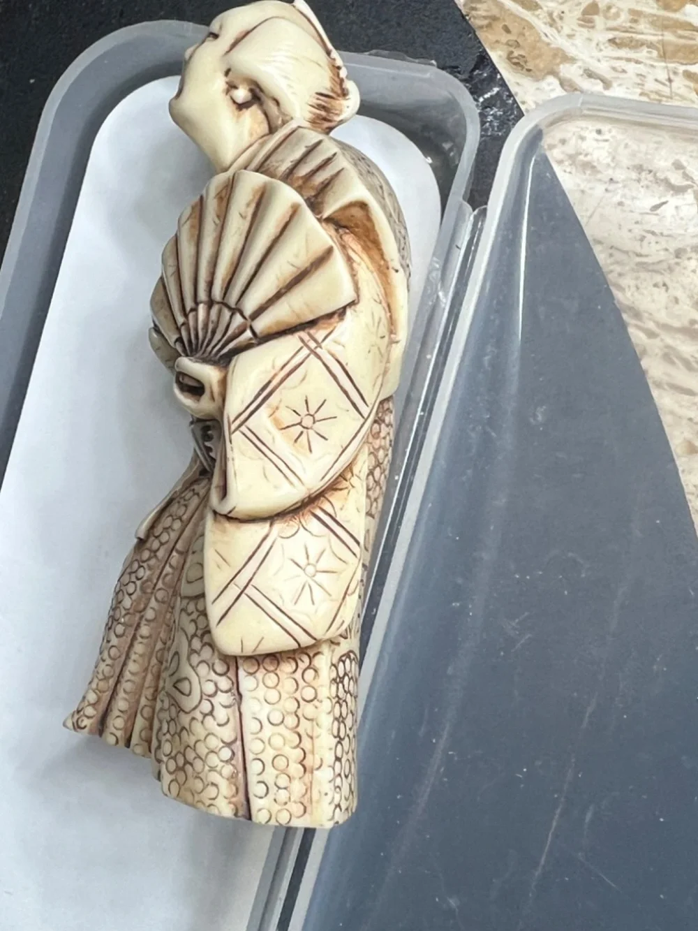 Hand-carved Japanese figurine likely a samurai or similar figure